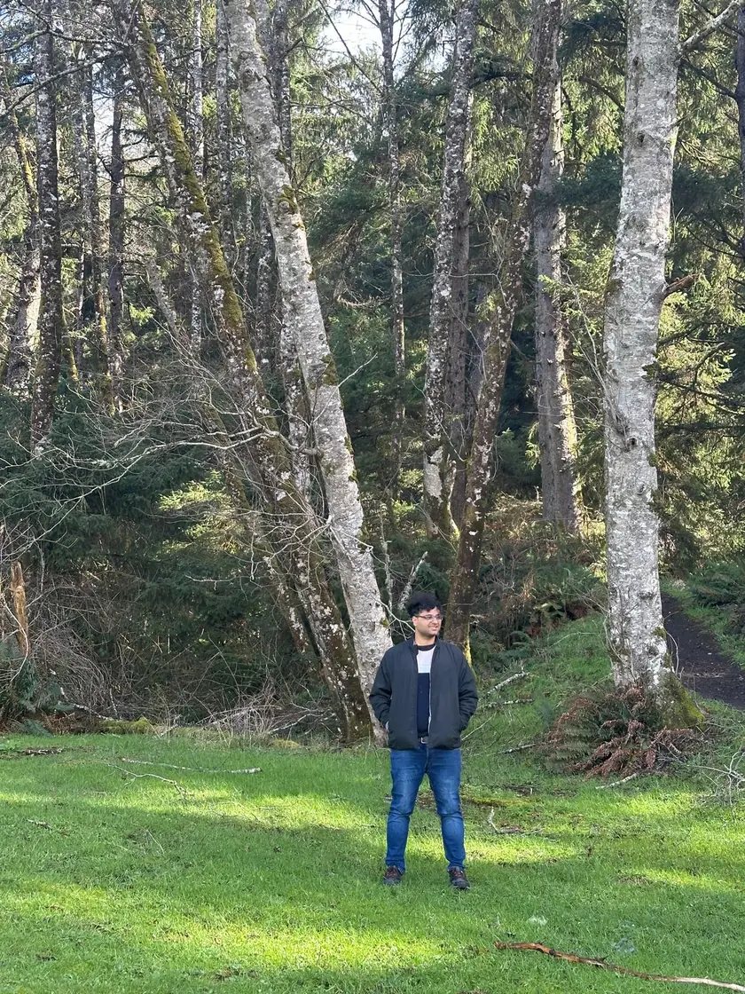 Dhrumil Joshi standing in a forest clearing